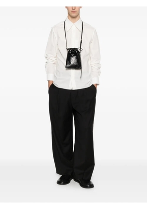 SEWMOD pleated logo-detail trousers - Black