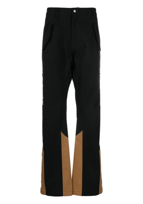 RHUDE logo-embroidered panelled trousers - Black