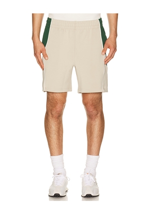 Students Golf Exhibition Track Shorts in Tan. Size S. Also in L, M, XL/1X.