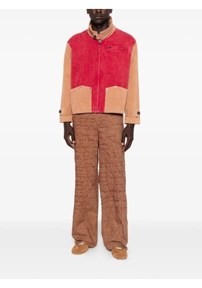 KidSuper embroidered scribble-pattern trousers - Brown