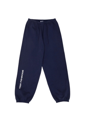 Gosha Rubchinskiy logo-print cuffed track pants - Blue