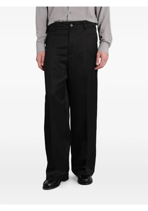 Costumein pressed-crease wide-leg trousers - Black