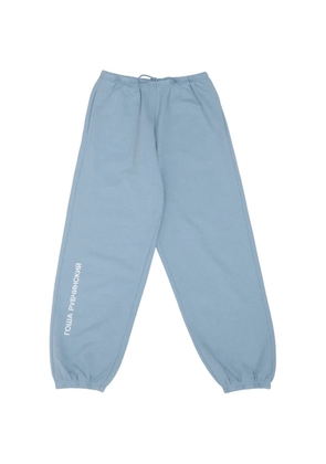 Gosha Rubchinskiy logo-print track pants - Blue