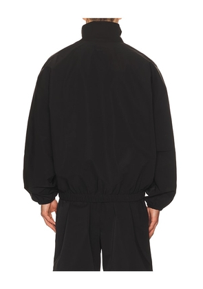 Fear of God ESSENTIALS Active Trace 1/2 Zip Track Jacket in Black. Size XS. Also in S, M, L, XL/1X.
