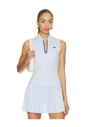 Lacoste Tennis Performance Top in Baby Blue. Size 34. Also in 32, 36, 40.