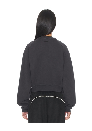 Fear of God ESSENTIALS Campus 90's Cropped Raglan Crewneck in Black. Size XS. Also in S, M, L.