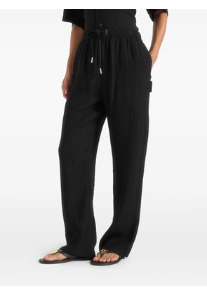 Manière De Voir Addison textured relaxed-fit trousers - Black