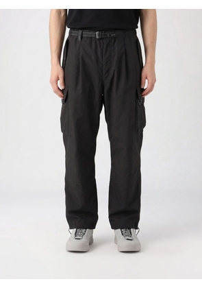 AND WANDER Pants Men color Black