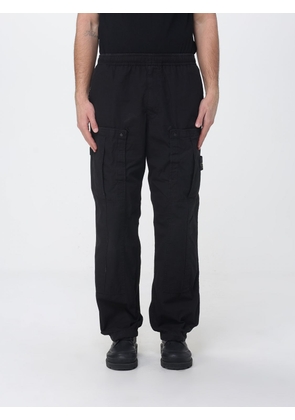 STONE ISLAND Pants Men color Black