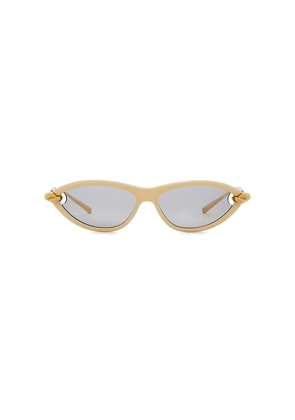 Bottega Veneta Cat Eye Sunglasses in Beige, Gold, & Grey.