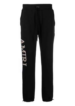 AMIRI logo print track pants - Black