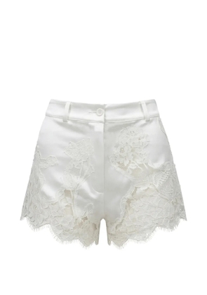 Almaz Pillowtalk lace-appliqué mini shorts - White