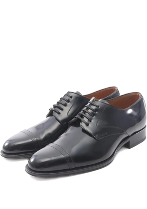 Christian Dior Pre-Owned 2010s embossed-logo leather loafers - Black