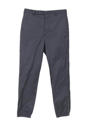 Prada Pre-Owned 2010s stripe zip trousers - Blue