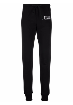Love Moschino logo-print slim-cut joggers - Black