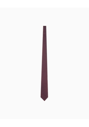 Silk necktie with a small geometric pattern