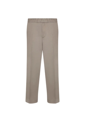 Costumein elasticated-waistband pressed-crease trousers - Neutrals