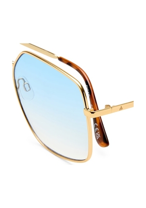 AIRE Altair Sunglasses in Metallic Gold.