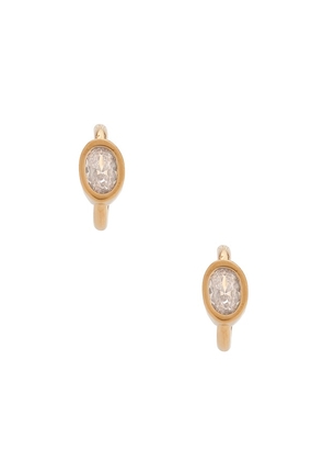 Alexa Leigh Bezel Oval Hoop Earrings in Metallic Gold.