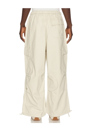 DRMERS CLUB Smiley Logo Parachute Pants in Cream. Size S. Also in M, L, XL/1X.
