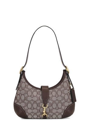 Coach Originals Signature Jacquard Hamptons Hobo in Brown.