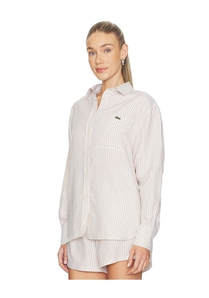 Lacoste Oversized Fit Toile Shirt in Beige. Size 32. Also in 34, 38, 40, 42.
