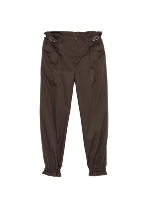 Kiko Kostadinov buckle-detail ruffled-cuff trousers - Grey