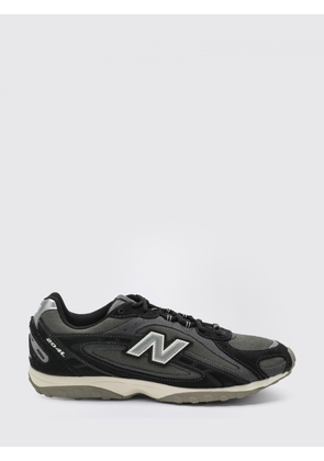 NEW BALANCE Sneakers Men color Black
