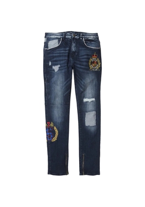 Staple distressed crest-embroidered jeans - Blue