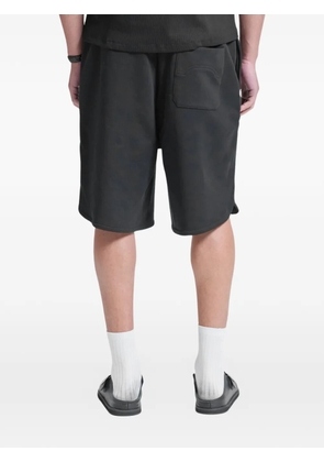 RETERNITY Notre Dame logo-print track shorts - Black
