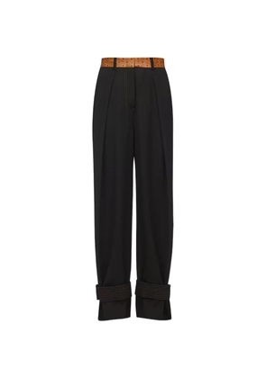 MCM monogram-print waistband pleated trousers - Black