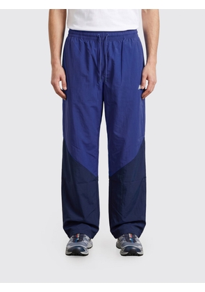 NEW BALANCE Pants Men color Blue