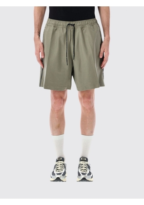 NIKE Shorts Men color Green