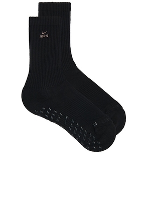 NikeSKIMS Dri-FIT Pilates Grip Crew Sock in Obsidian & Armor - Black. Size M (also in S).