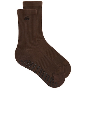 NikeSKIMS Dri-FIT Pilates Grip Crew Sock in Sepia & Obsidian - Brown. Size M (also in S).