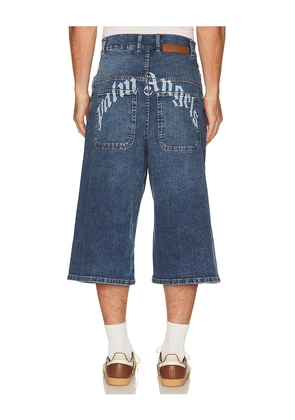 Palm Angels Curved Logo Denim Skater Short in Blue. Size 33. Also in 30, 31, 32, 34, 36.