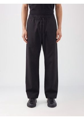 FEAR OF GOD Pants Men color Black