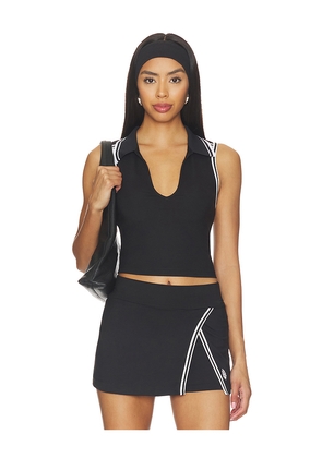 Free People x FP Movement Forehand Polo Top in Black. Size XS. Also in S, M, L, XL.