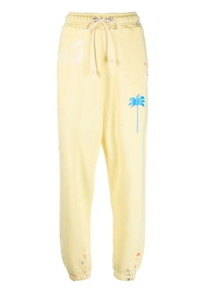 Palm Angels palm-tree print track pants - Yellow