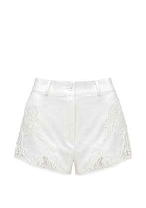 Almaz Pillowtalk lace-appliqué mini shorts - White
