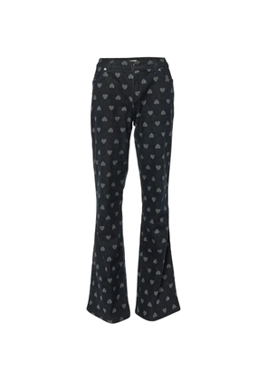 Moschino Pre-Owned heart-pattern flared jeans - Blue