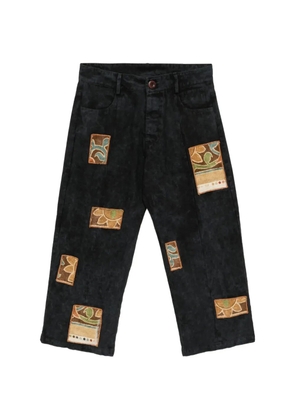 Stain Shade patchwork acid-wash jeans - Black