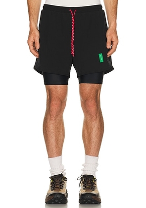 District Vision Layered Trail Shorts in Black - Black. Size XL/1X (also in M, L).