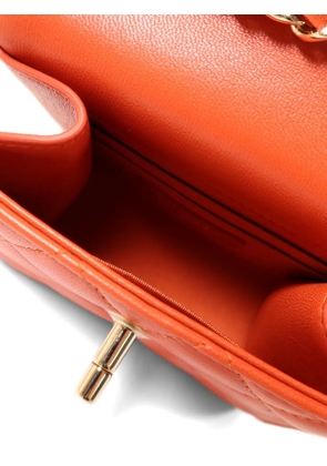 CHANEL Pre-Owned CC turn-lock quilted shoulder bag - Orange