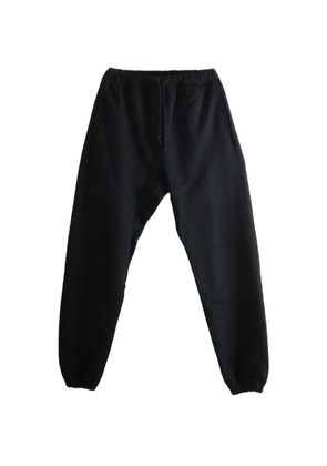 MONONOKE MADE sunflower-print track pants - Black