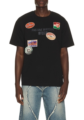 Pas Une Marque Luggage Tag Pas Tee in Black - Black. Size M (also in S, L, XL/1X).