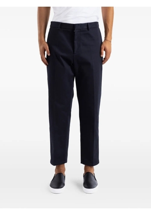 Jil Sander tapered-design pressed-crease trousers - Blue