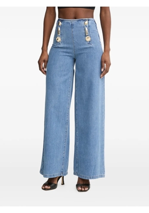 SIMONA CORSELLINI button-embellished jeans - Blue