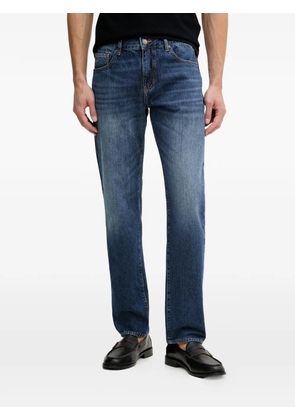 Armani Exchange logo-embroidered faded jeans - Blue