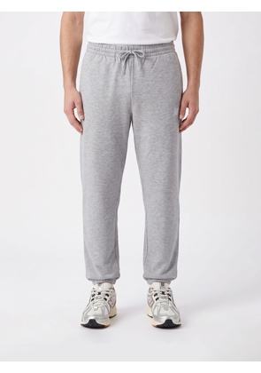 NEW BALANCE Pants Men color Grey